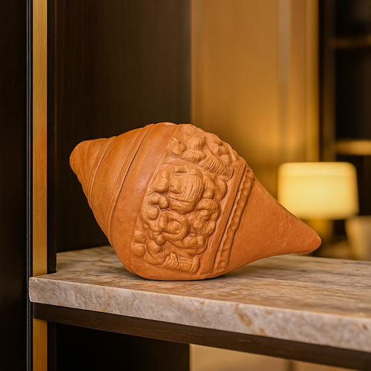 Back view of brown terracotta shankha conch shell handcrafted in Panchmura, Bankura, West Bengal, with smooth curves and earthy finish Lifestyle Image