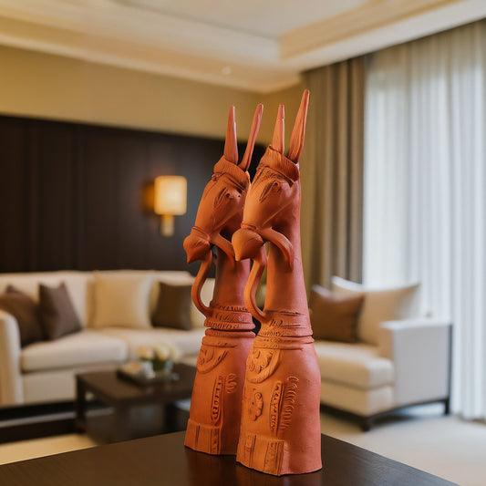 Side view of handcrafted traditional pair terracotta horse statues in warm natural clay, made in Panchmura, Bankura, decorative home accents lifestyle image