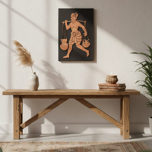 Handcrafted Indian rural life wall art panel displayed in a minimalist living space with wooden bench and natural decor.