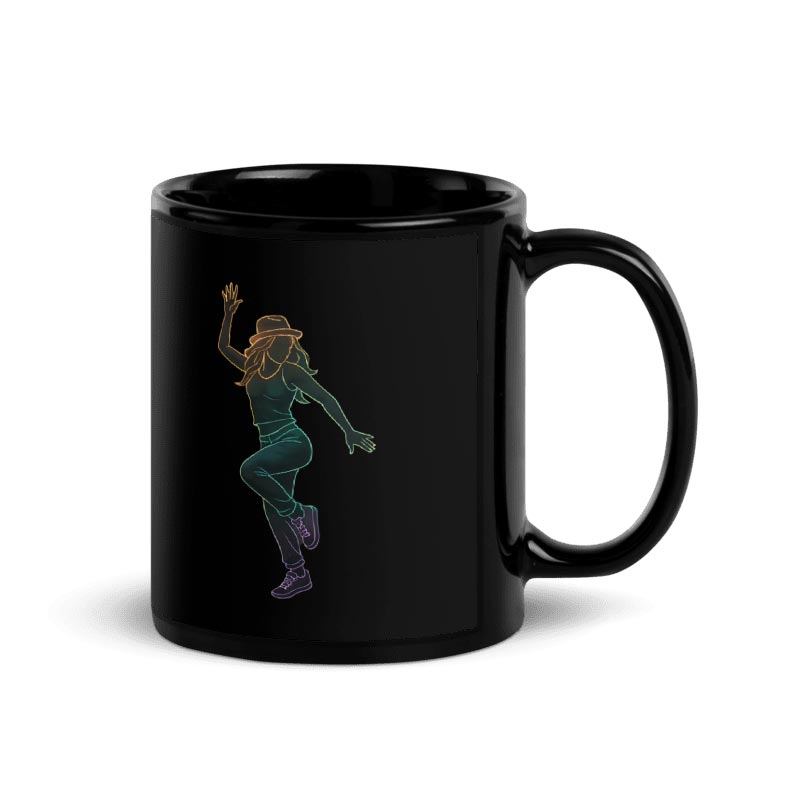 A glossy black ceramic coffee mug featuring a vibrant neon gradient line-art illustration of a woman dancing. The design depicts a stylish dancer in a hat and streetwear striking a dynamic pose, contrasting sharply against the dark background for a modern, edgy look.