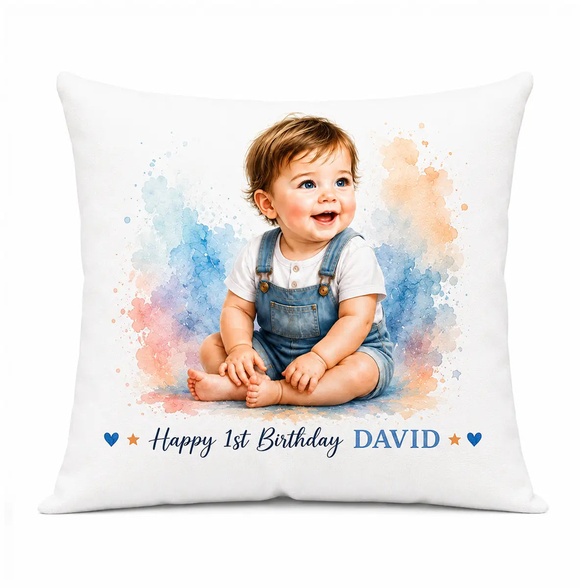 A decorative custom watercolor baby portrait throw pillow featuring a smiling baby boy in denim overalls, surrounded by pastel splashes and Happy 1st Birthday David text. Free shipping by Incotta.