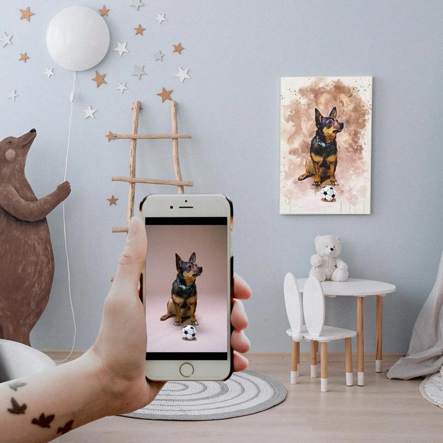A custom watercolor pet portrait canvas featuring a small black and tan dog with a soccer ball, hanging on a playfully decorated children's room wall behind a hand holding a smartphone with the original reference photo. Free shipping by Incotta.