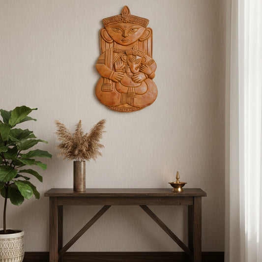 Traditional Indian terracotta wall decor featuring a durga and ganesh motif, styled with natural textures for ethnic home decor.