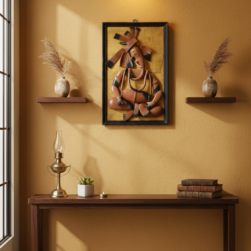 Indian tribal Ganesha wall art displayed above a wooden console table, styled with shelves, vases, and warm lighting in a modern living space.