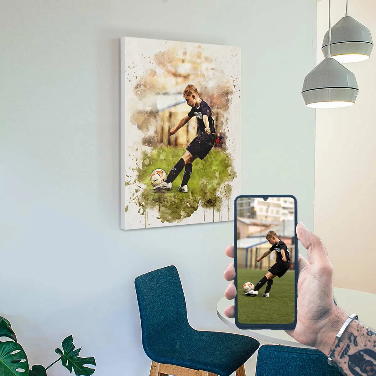 A custom watercolor portrait canvas featuring a young boy kicking a soccer ball, displayed on a light blue wall above modern blue dining chairs. Free shipping by Incotta.