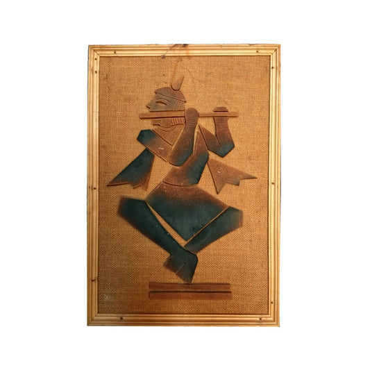 Front view of handmade terracotta Lord Krishna Playing a flute wall hanging in natural clay tones from Panchmura, India, spiritual home décor