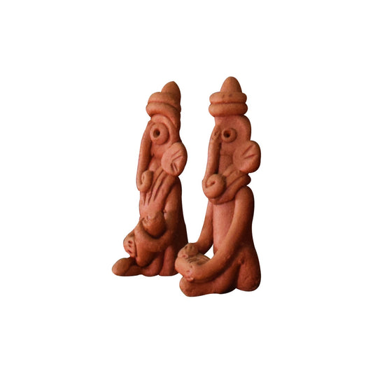 Left view of a handcrafted terracotta Ganesha figurines in warm clay, seated posture, made in Panchmura, Bankura, decorative showpiece pair
