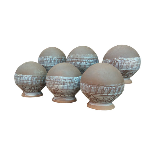 Side view of a handmade terracotta clay pot in natural brown, ideal for planting or indoor decoration, crafted in Panchmura, India