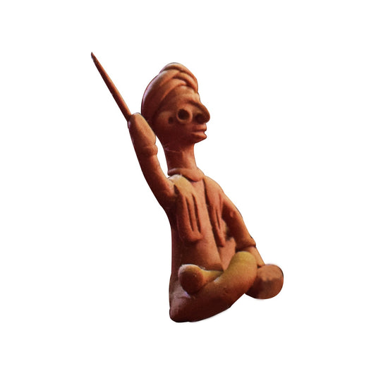 Side view of single handcrafted terracotta musical man figurine in brown clay from Panchmura, Bankura, showing a seated figure playing a traditional instrument