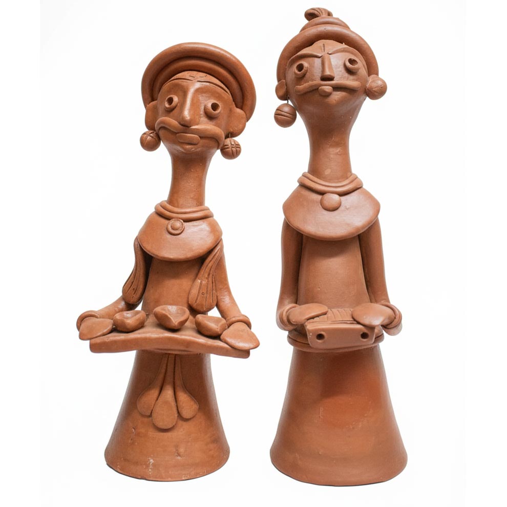 Indian tribal terracotta sculptures representing folk culture and music, handcrafted clay figurines for ethnic and boho interior styling.