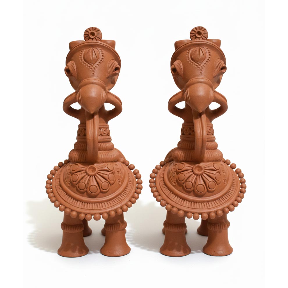 Indian folk art terracotta horse sculptures in pair, handcrafted clay decor for traditional interiors.