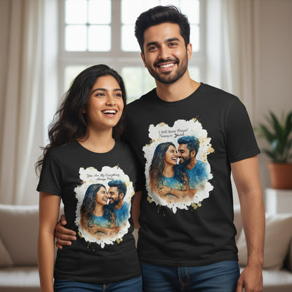 Happy couple wearing black custom watercolor portrait t-shirts indoors.
