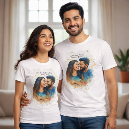 Smiling couple wearing white custom watercolor portrait t-shirts indoors.