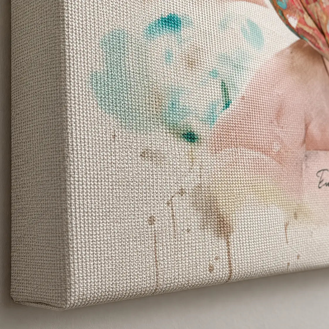 Close-up of a premium, heavily textured gallery-wrapped canvas showcasing its woven texture and a watercolor-style portrait of a baby.