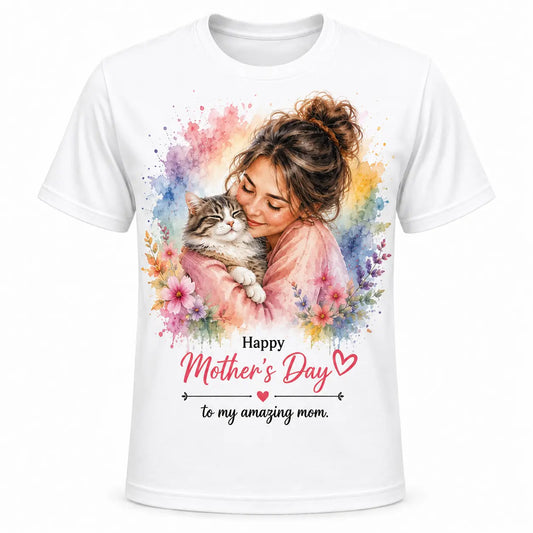 A custom white unisex t-shirt featuring a vibrant watercolor portrait of a smiling cat mom hugging her tabby cat, surrounded by pastel spring flowers and "Happy Mother's Day" text.