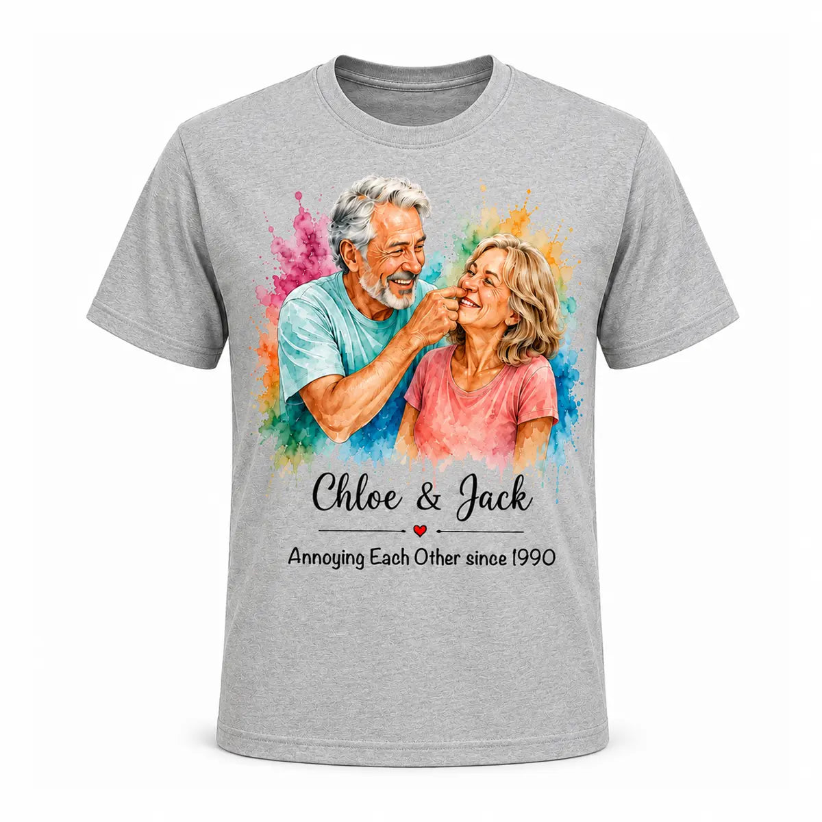 A grey unisex t-shirt featuring a custom watercolor portrait of a smiling older couple surrounded by vibrant paint splatters, with funny anniversary text below. Free shipping by Incotta.