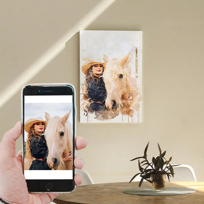 A custom watercolor portrait canvas featuring a woman in a cowboy hat and her light-colored horse, displayed on a sunlit living room wall above a wooden table. Free shipping by Incotta.