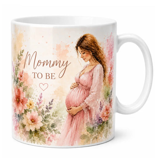 A beautifully customized glossy white ceramic coffee mug featuring a delicate watercolor portrait of an expecting mother in a pink dress, surrounded by pastel spring flowers and "Mommy TO BE" text.