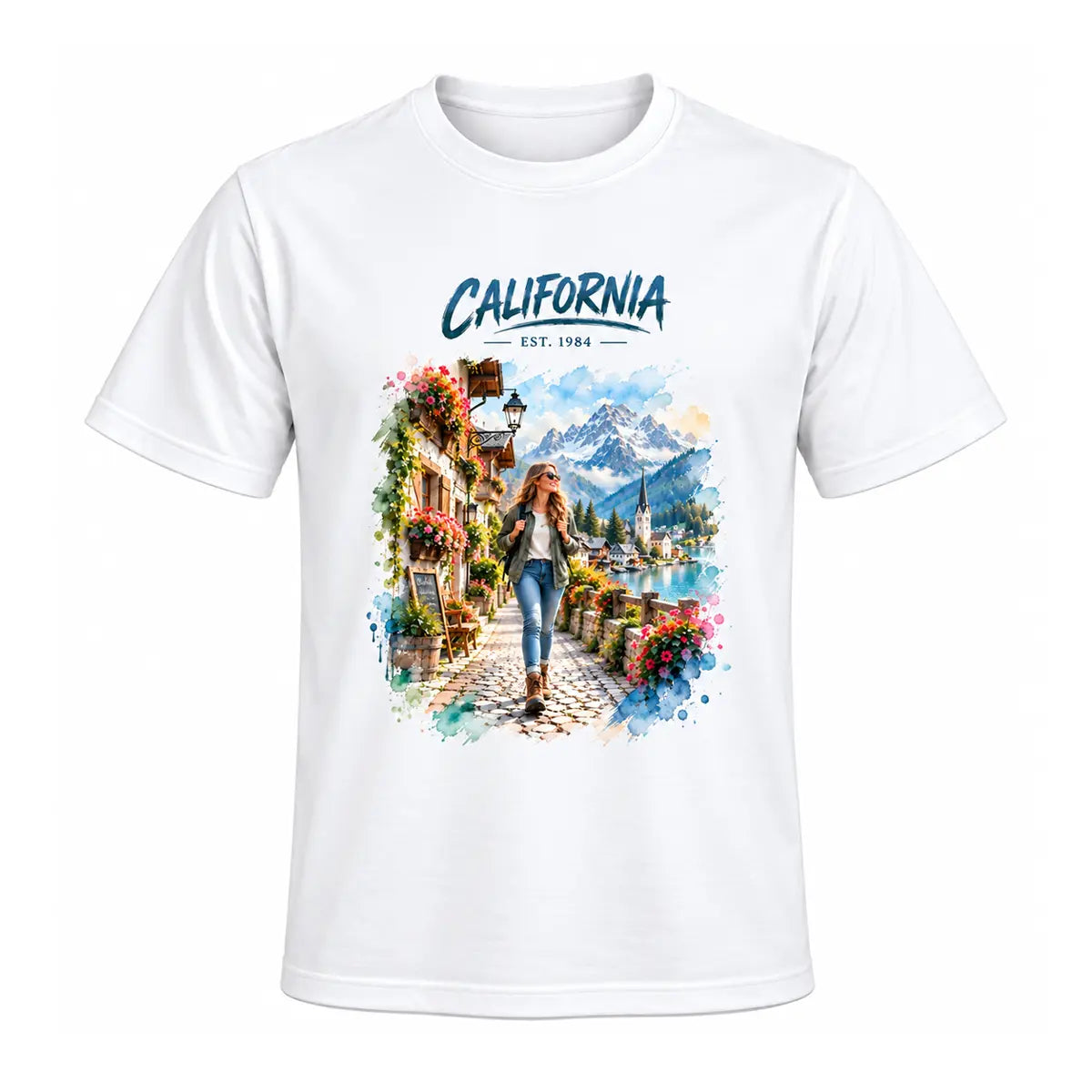 A white custom watercolor vacation destination graphic tee featuring a personalized alpine mountain village landscape and a female traveler. Free shipping by Incotta.