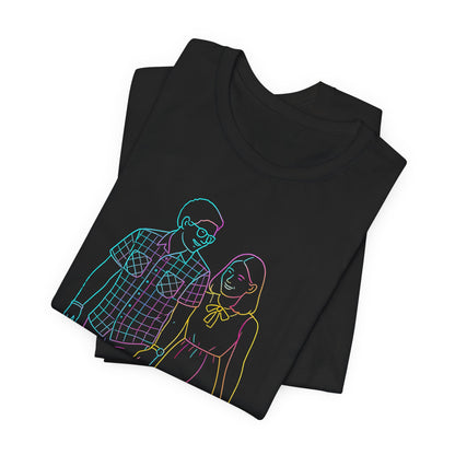White cotton t-shirt featuring a custom brown line art sketch of a couple walking, hanging on a wooden chair for aesthetic product photography.