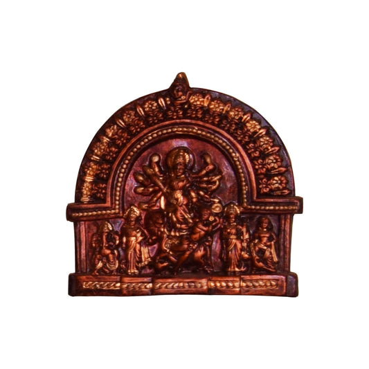 A front view of a handcrafted terracotta idol depicting Goddess Durga in the Mahishasuramardini form. This clay sculpture features a distinctive dark, antique-style finish, portraying the ten-armed goddess slaying the demon Mahishasura, accompanied by her divine family under a traditional decorative arch.