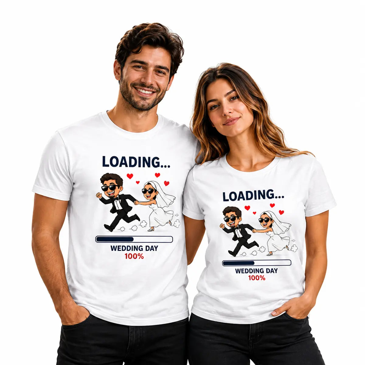 Couple wearing matching white T-shirts featuring a playful wedding loading design with a running bride and groom, hearts, and “Wedding Day 100%” graphic.