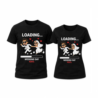 Matching black funny wedding day loading couple t-shirt set featuring a cute cartoon bride and groom running with a wedding day 100% progress bar.