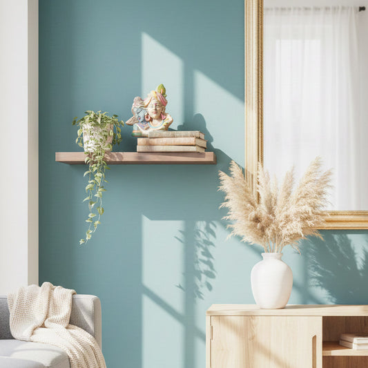 Radha Krishna spiritual decor displayed on a minimalist wall shelf, styled with books and greenery in a modern living space.