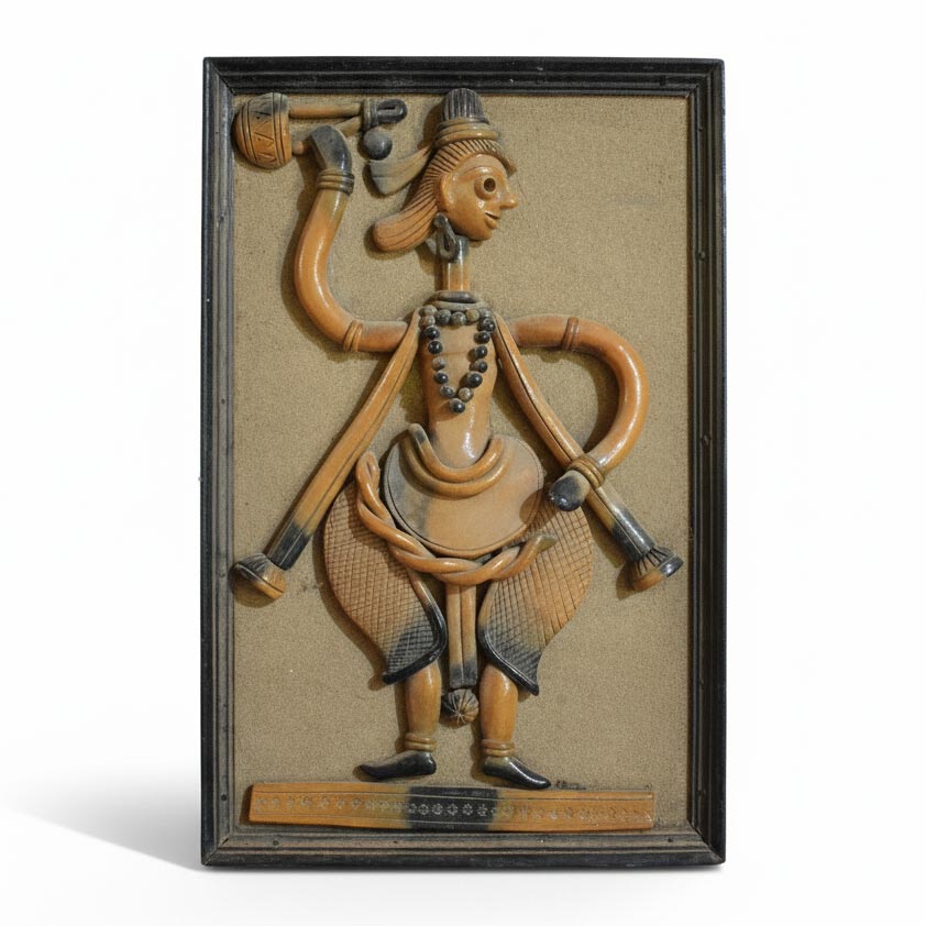 Traditional Indian terracotta wall panel with tribal dance figure, handcrafted clay folk art decor inspired by rural Indian culture.