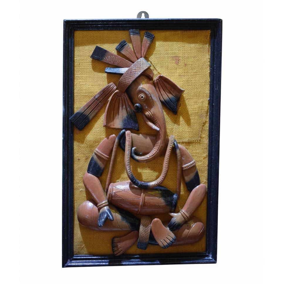 Handcrafted Indian tribal wall art depicting Lord Ganesha in folk style, ethnic wall hanging sculpture framed in wood.