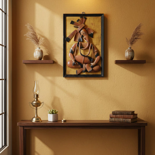 Indian tribal Ganesha wall art displayed above a wooden console table, styled with shelves, vases, and warm lighting in a modern living space.
