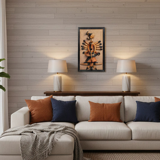 Indian handicraft tribal wall art mounted above a sofa, styled with table lamps and contemporary interior design.