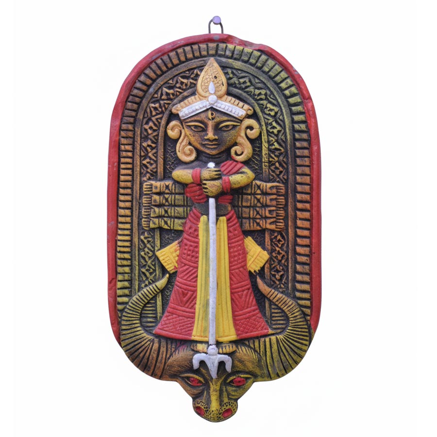 Indian folk art terracotta wall hanging featuring a stylized goddess  durga figure, handcrafted ethnic clay art for spiritual and cultural home decor.