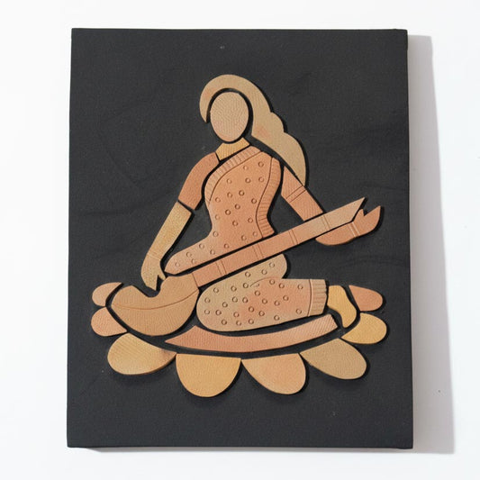 Handcrafted Indian wall art portraying a swarsati musician with veena, modern ethnic decor on black backdrop.