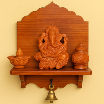 Front view of a handcrafted terracotta Ganesha holding an open book, natural clay wall hanging, made in Panchmura, Bankura Lifestyle Image