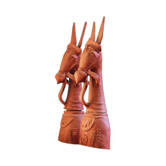 Side view of handcrafted traditional pair terracotta horse statues in warm natural clay, made in Panchmura, Bankura, decorative home accents