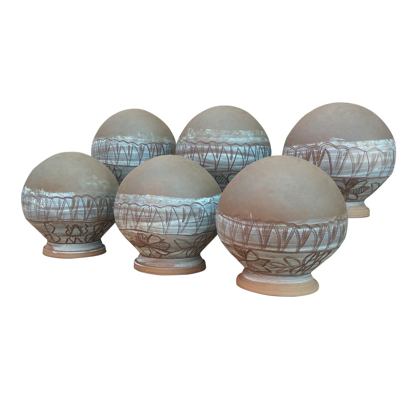 A studio shot showing a set of six spherical terracotta pots arranged in two rows. These handmade clay planters feature sturdy pedestal bases and are adorned with intricate white tribal etchings and traditional painted designs, reflecting Panchmura style craftsmanship for ethnic home and garden decor.