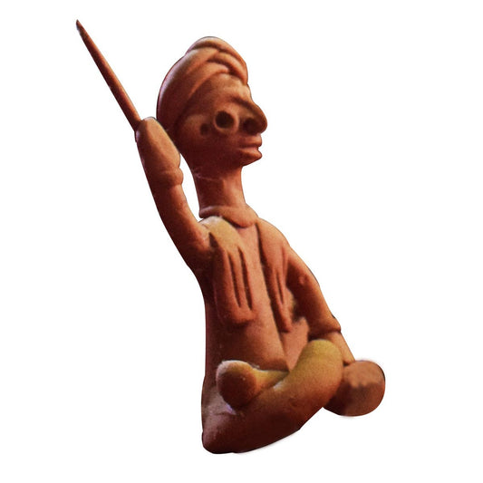 Side view of single handcrafted terracotta musical man figurine in brown clay from Panchmura, Bankura, showing a seated figure playing a traditional instrument