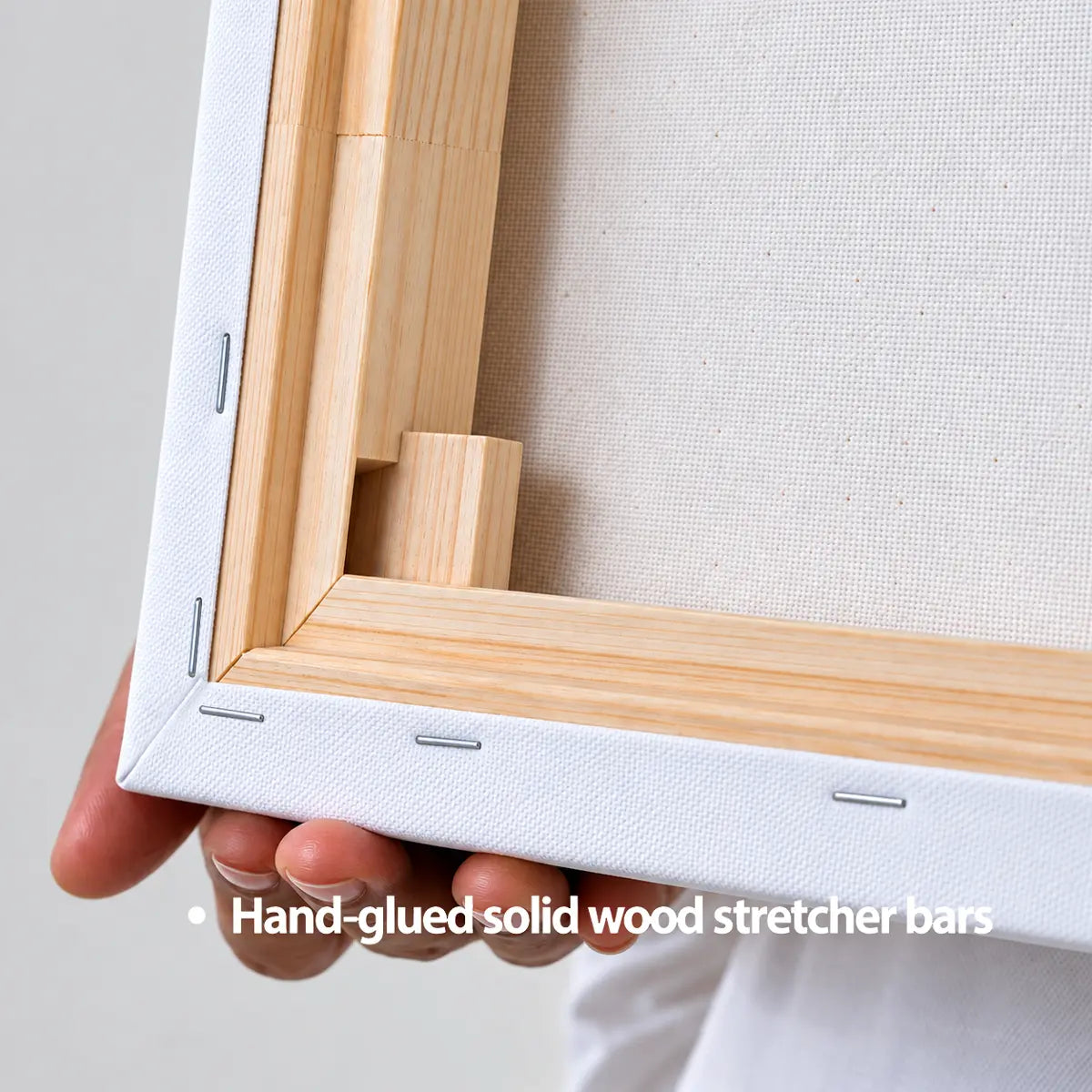 Back view of Incotta canvas print showing solid wood stretcher bars and corner wedges for durable tension.