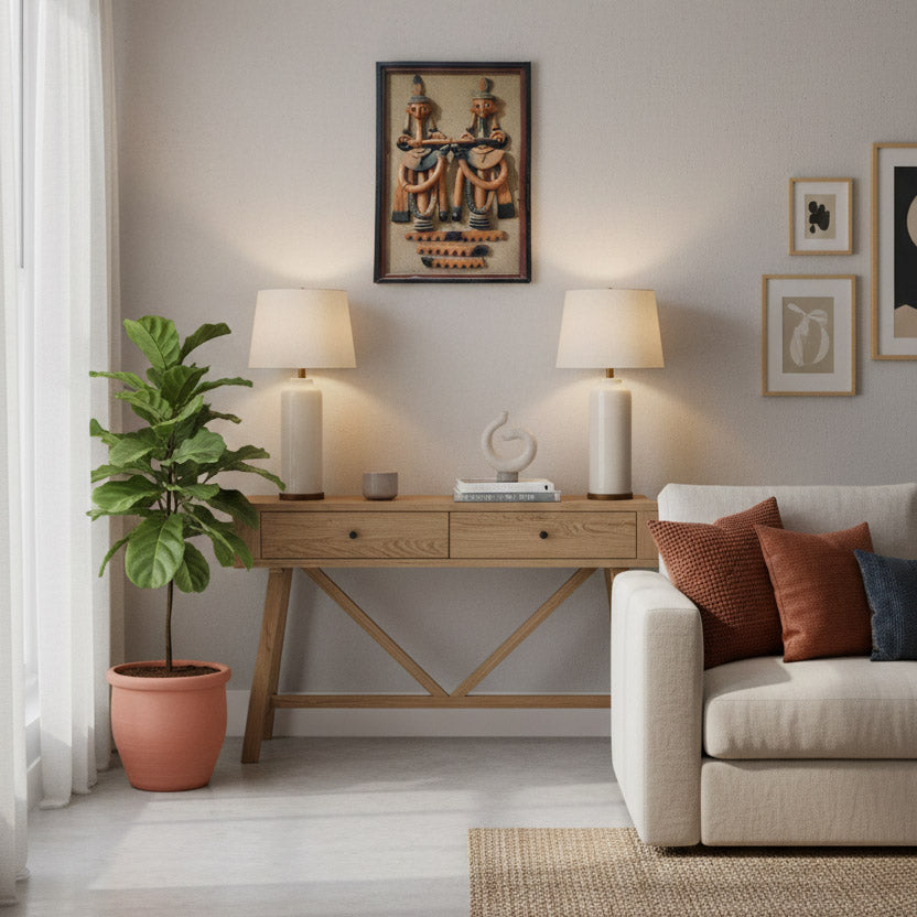 Traditional Indian tribal musician wall art displayed in a contemporary living space with console table, lamps, and indoor greenery.