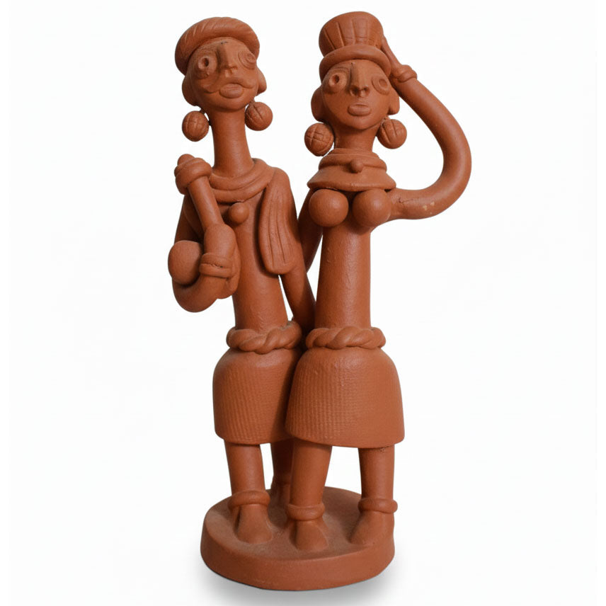 Indian folk art terracotta figurine of a tribal couple, handcrafted clay sculpture for ethnic home decor and cultural interior styling.